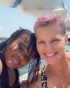 Stacey and her daughter on sailboat